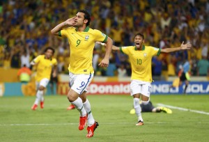 Brazil's Fred celebrates after scoring the team's third goal during their Confederations Cup final soccer match against Spain at the Estadio Maracana in Rio de Janeiro